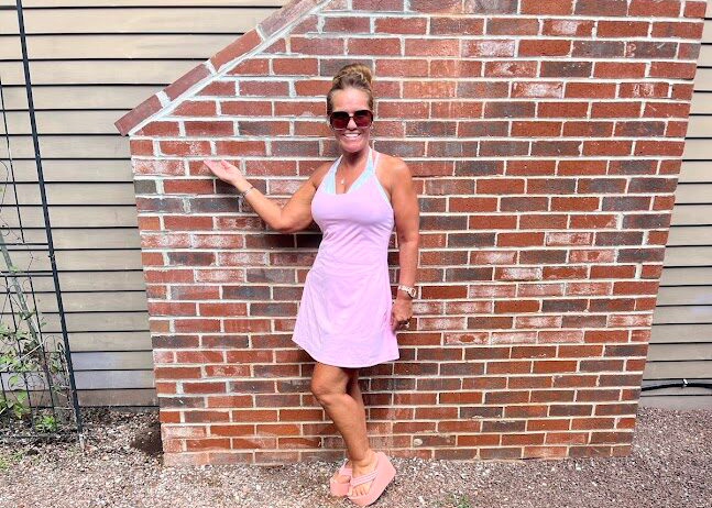 Woman posing with newly repaired chimney